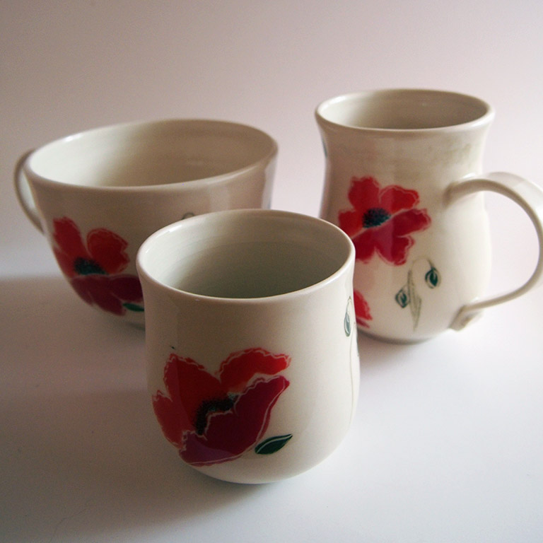Windring Hand Made Pottery: coffee and teacups featuring red poppy design